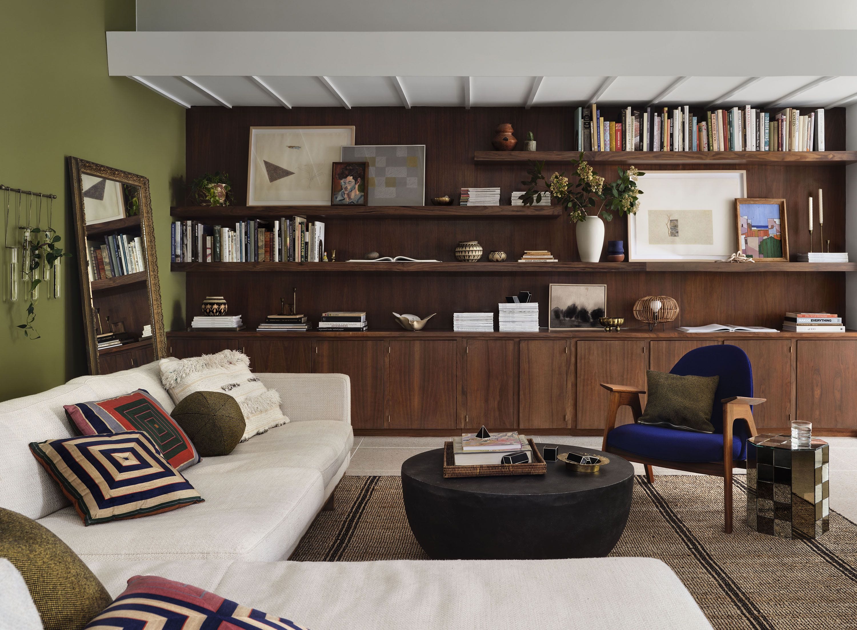 Collected interior with rich walnut cabinetry and vintage furnishings